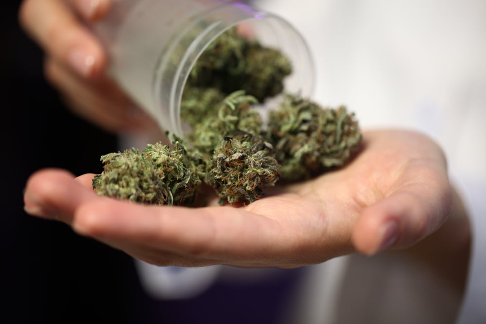 marijuana buds pouring out of jar