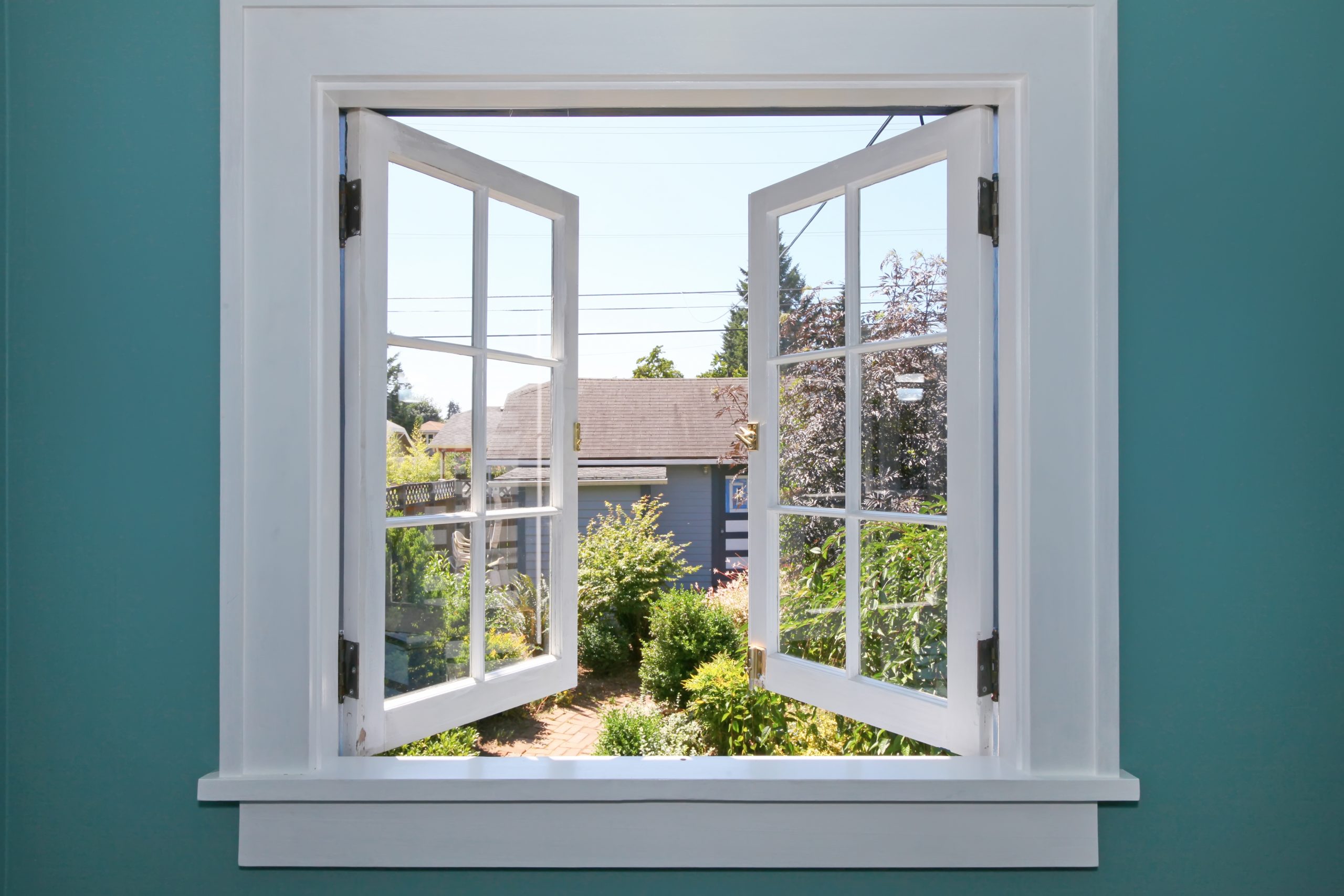 open window looking out to a garden